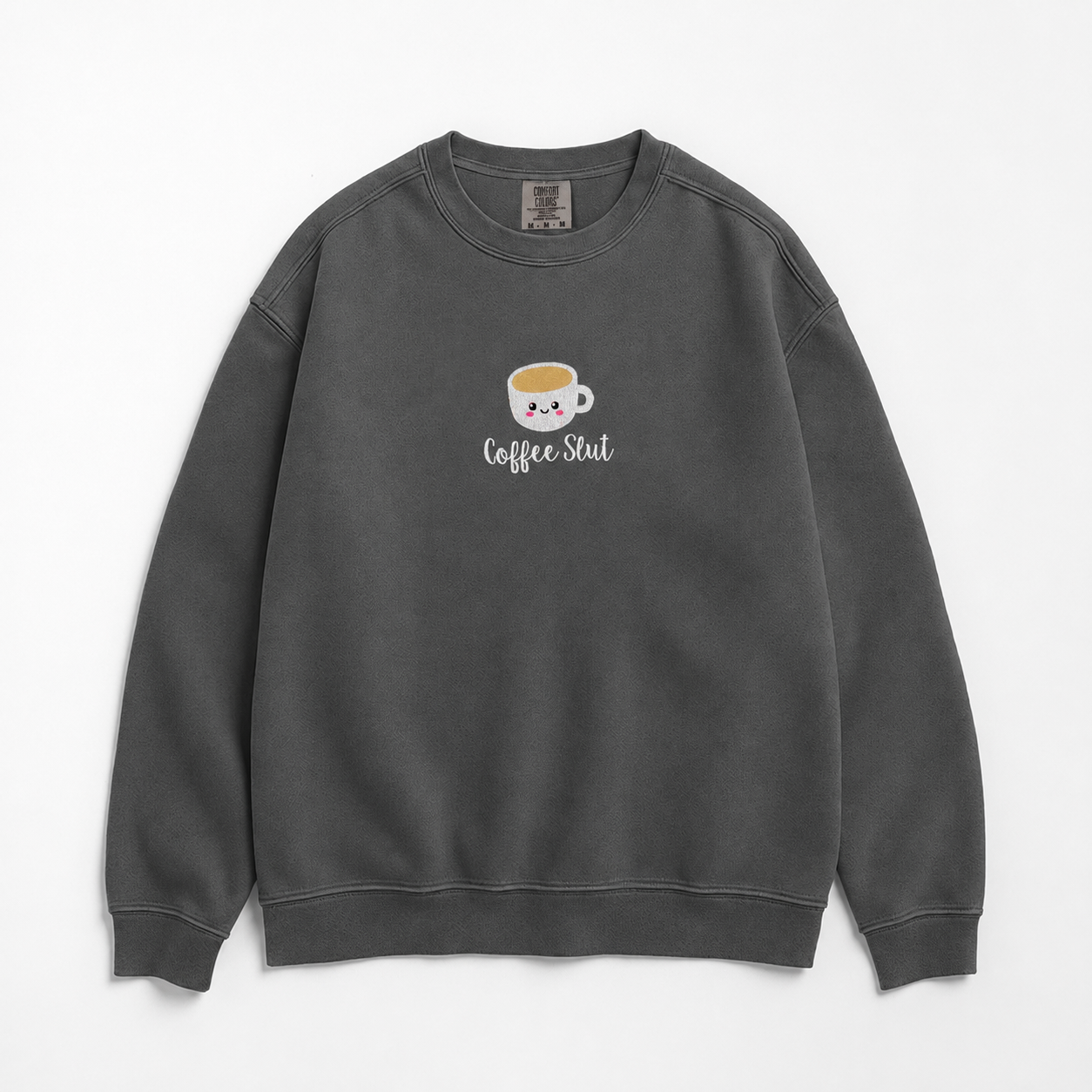 A dark gray crewneck sweatshirt featuring a cute cartoon coffee cup embroidered with a smiling face and the text 'Coffee Slut' written below it, displayed on a clean white background.