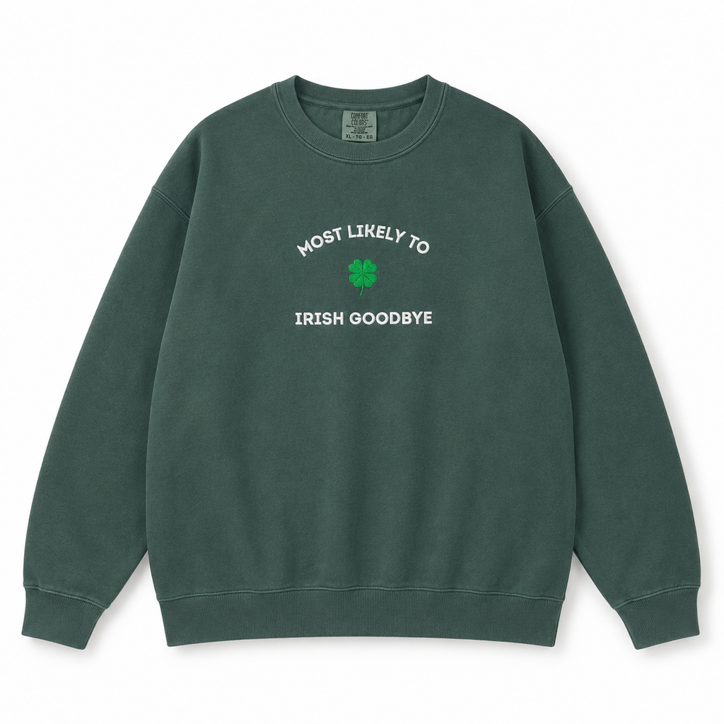 A dark green crewneck sweatshirt with white text reading 'MOST LIKELY TO IRISH GOODBYE' and a green shamrock embroidered on the chest, displayed on a clean white background.