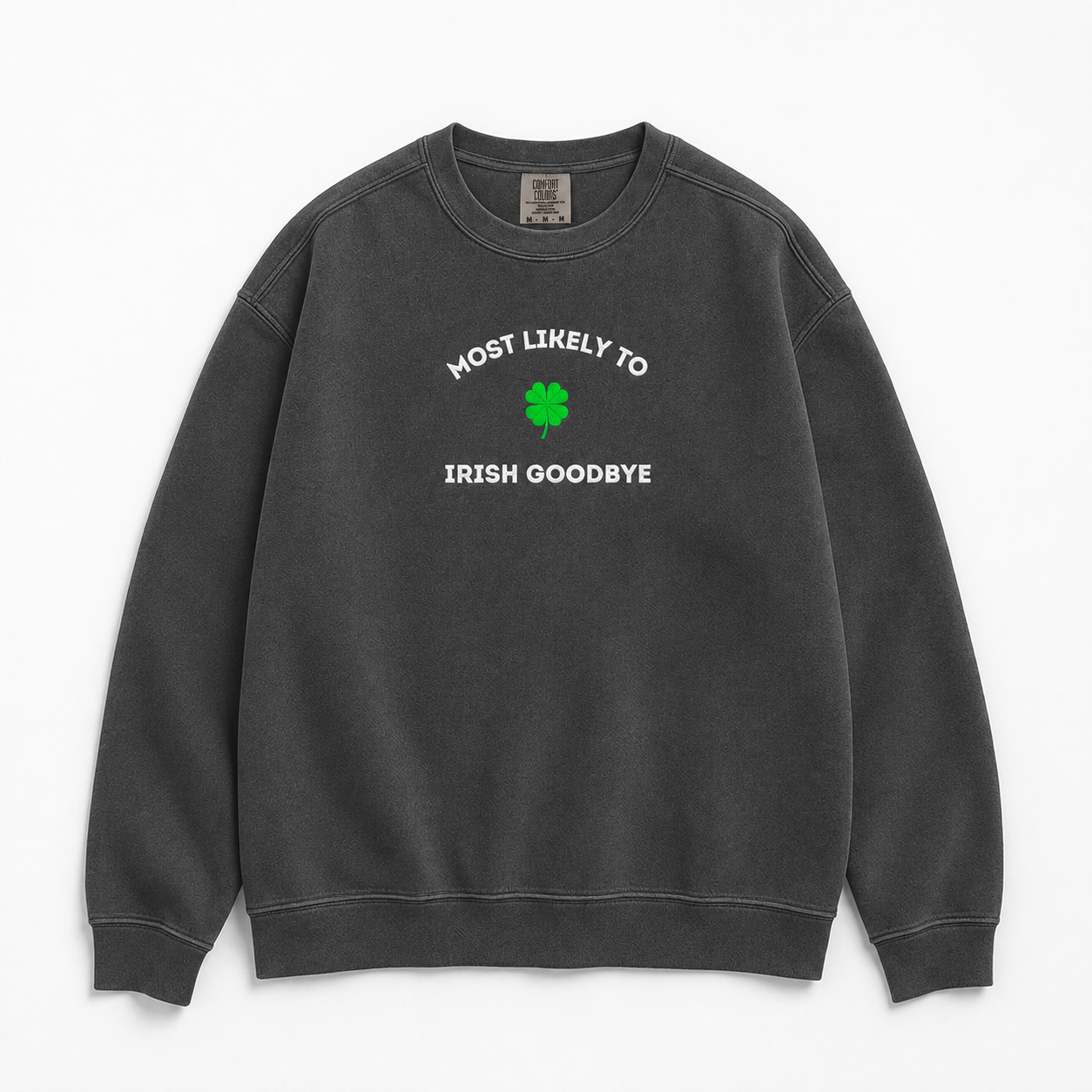 A dark gray crewneck sweatshirt with a graphic on the chest that is embroidered 'MOST LIKELY TO IRISH GOODBYE' in white text around a green four-leaf clover, displayed on a clean white background.