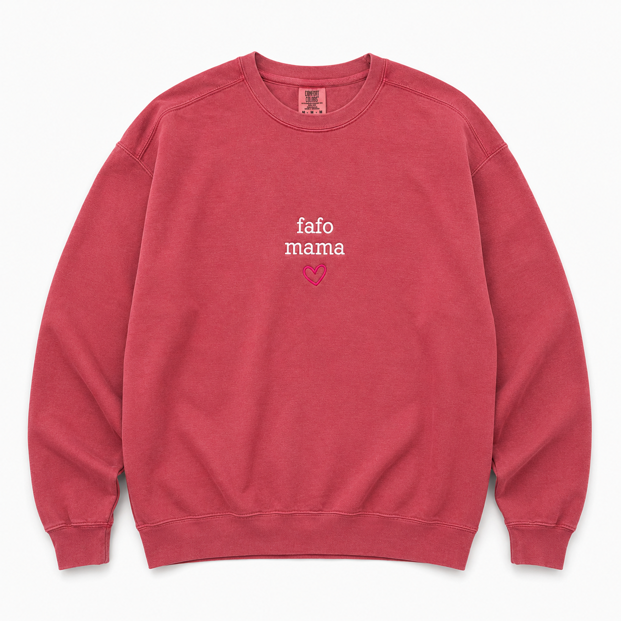 A dusty rose crewneck sweatshirt featuring  'fafo mama' embroidered in white and a small pink heart on the chest, displayed flat against a light gray background.