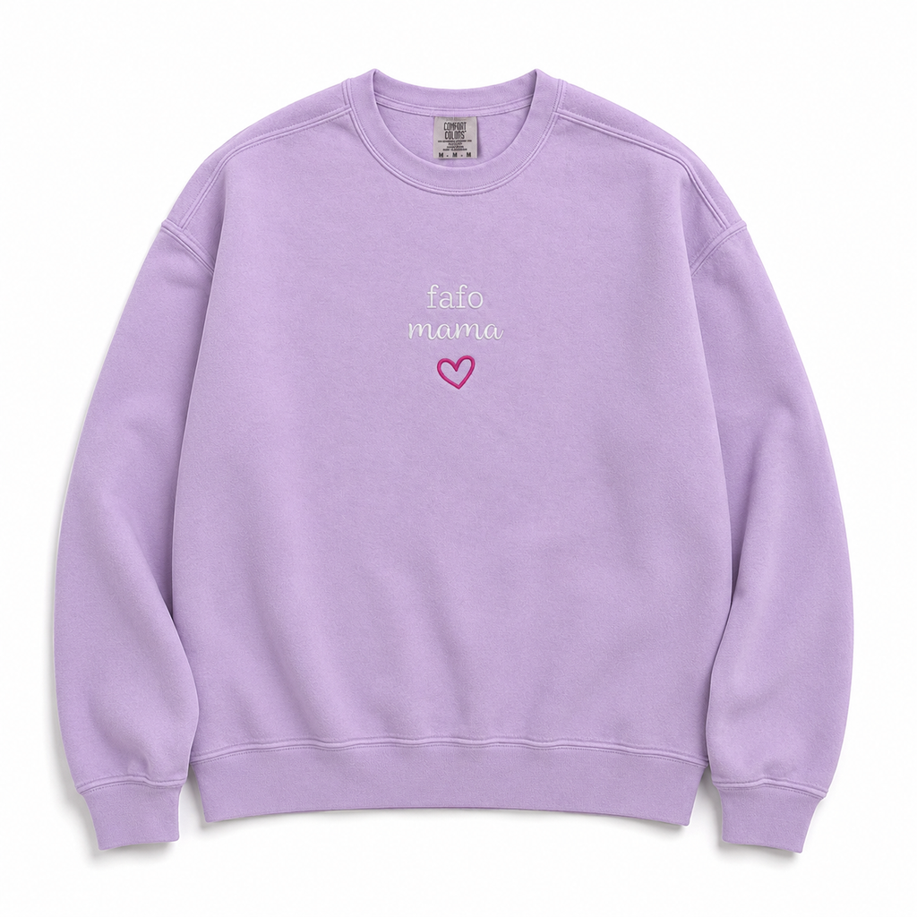 A light purple crewneck sweatshirt featuring embroidered text 'fafo mama' in white script and a small pink heart outline on the chest, displayed flat against a white background.