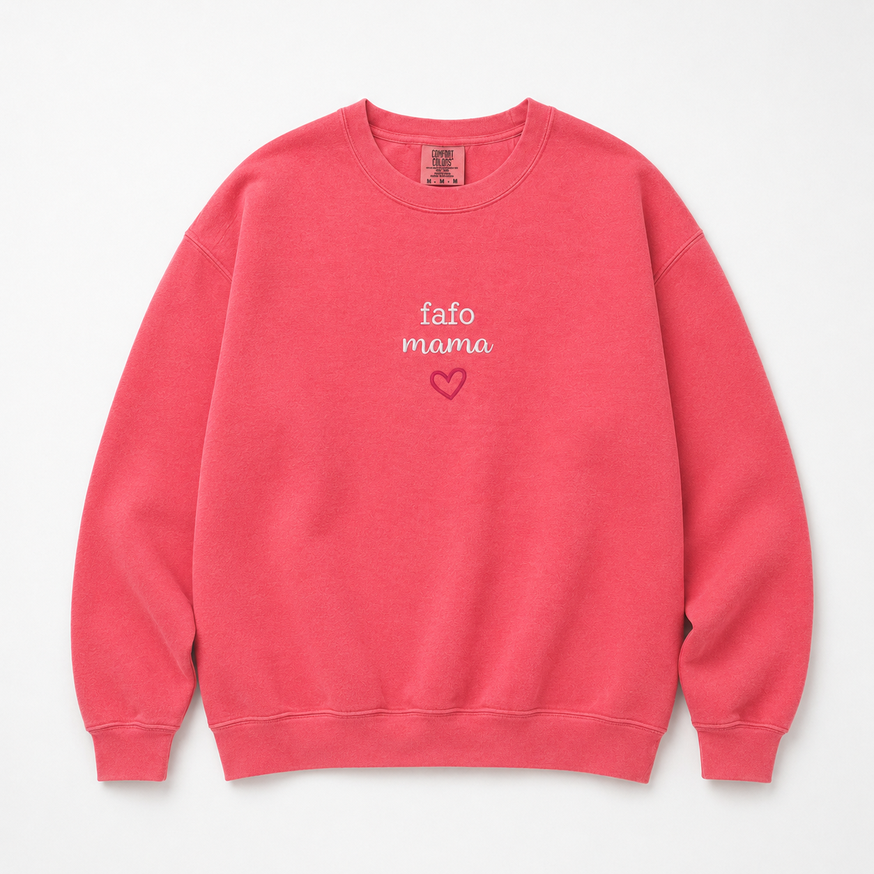 A coral pink crewneck sweatshirt with 'fafo mama' and a small heart embroidered on the chest, displayed flat against a light gray background.