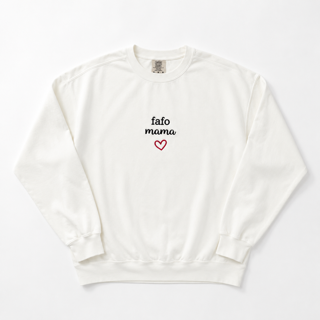 An off-white crewneck sweatshirt with 'fafo mama' embroidered in black script and a small red heart outline on the chest, displayed flat against a light gray background.