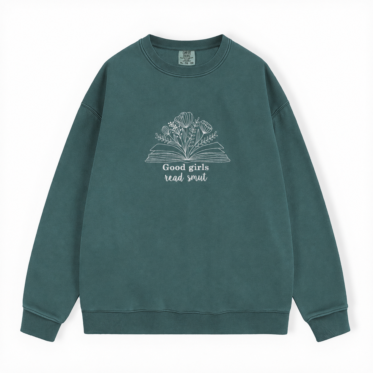 A dark green crewneck sweatshirt with a white graphic of an open book and flowers, featuring the text 'Good girls read smut' on the front, displayed against a clean white background.