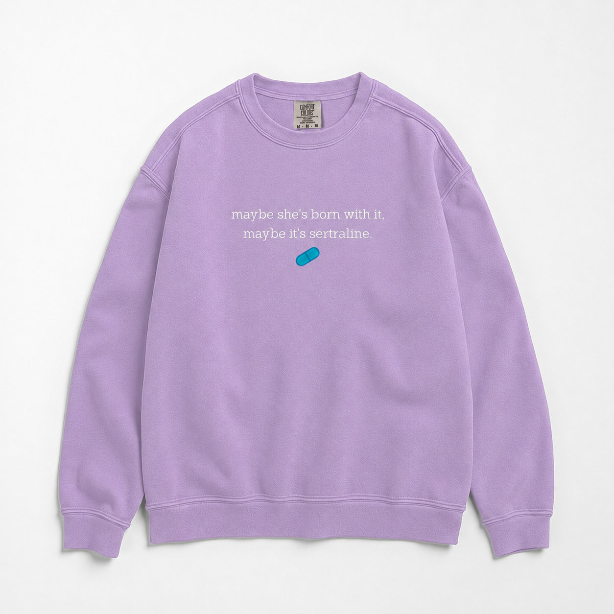 A lavender crewneck sweatshirt featuring white text that reads 'maybe she's born with it. maybe it's sertraline.
